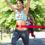 Marathon runner crossing finish line